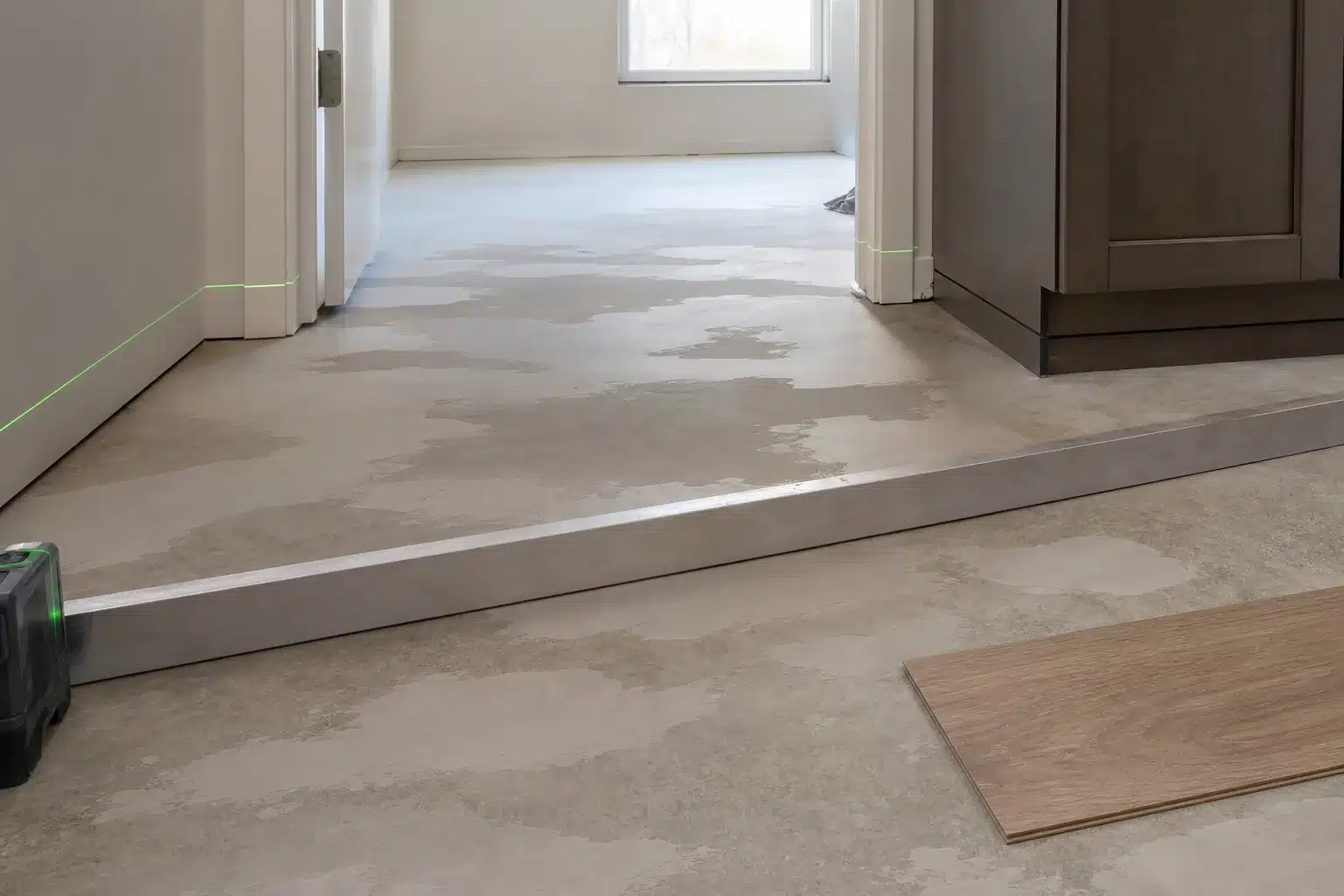 Subfloor prep and flatness detail before premium luxury vinyl plank installation