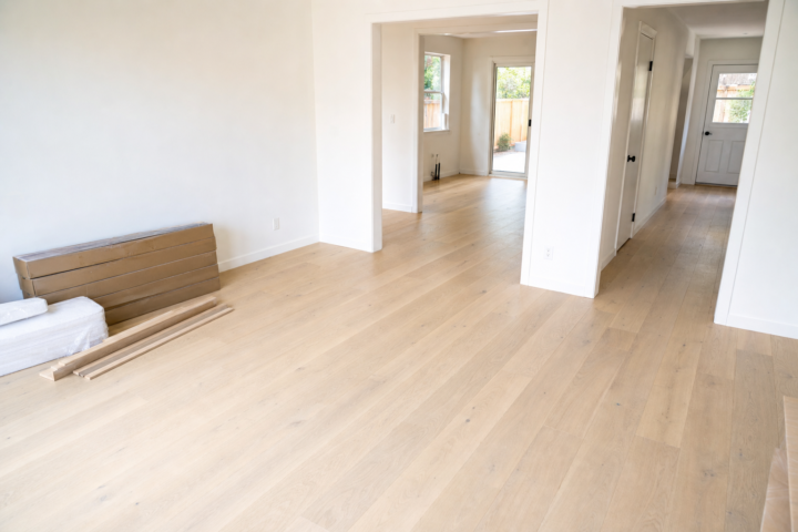 Round Rock Flooring Company installation planning with light wood plank flooring — Austin Flooring office: 12343 Hunters Chase Dr, Austin, TX 78729; GPS 30.442344, -97.769885