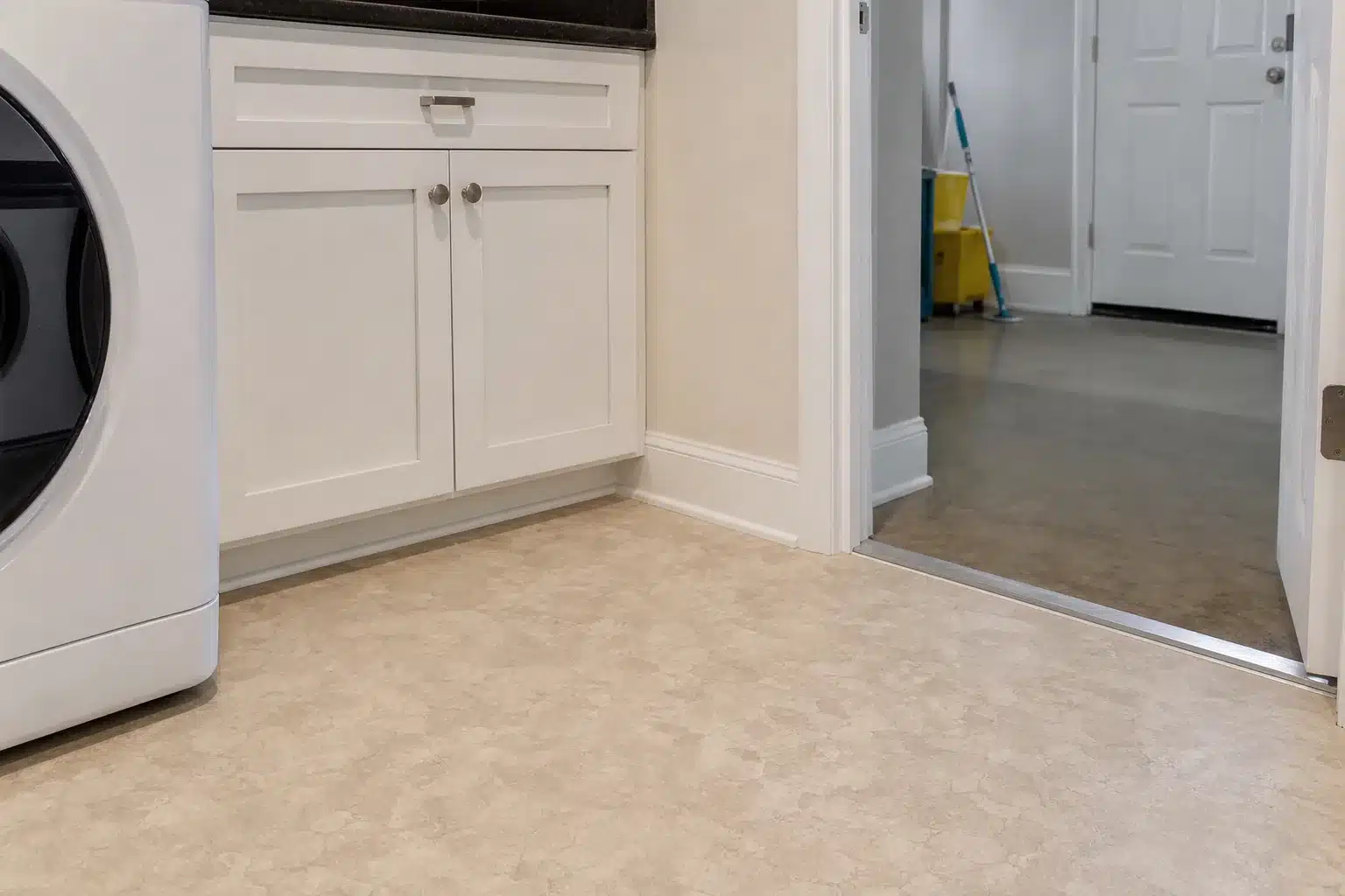 Sheet vinyl flooring in a kitchen laundry or rental room for Austin TX installation planning